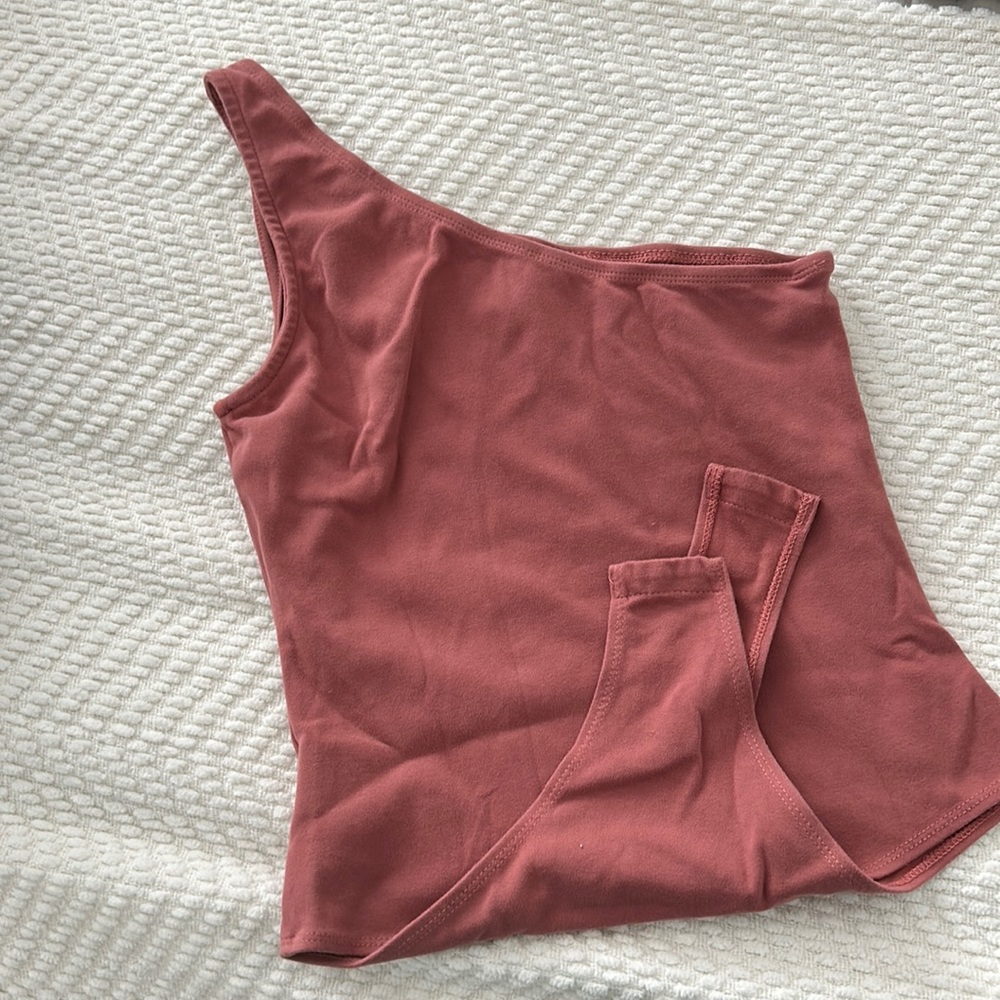 Rose colored one shoulder body suit
